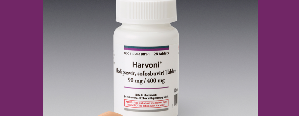 prescription bottle of Harvoni and pill