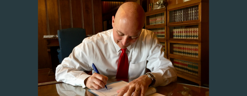 Gov. Pete Ricketts signing legislation