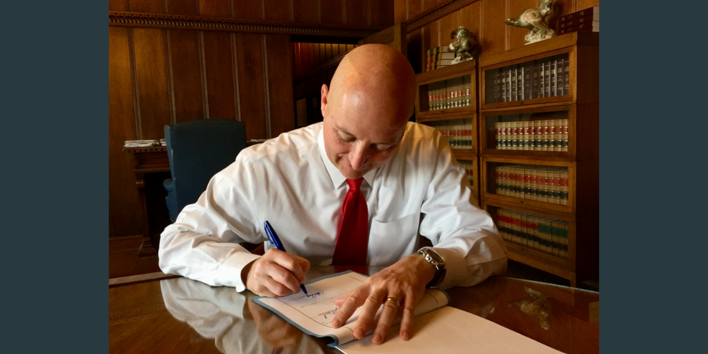 Gov. Pete Ricketts signing legislation