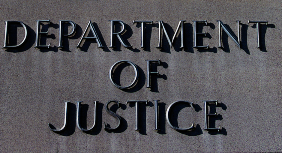 Department of Justice sign on a building facade