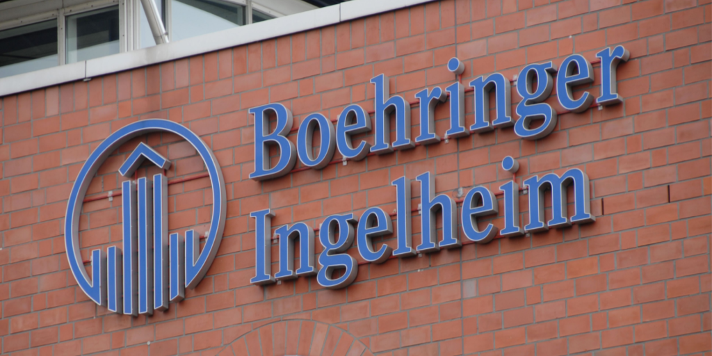 Boehringer Ingelheim wordmark and logo mounted on building