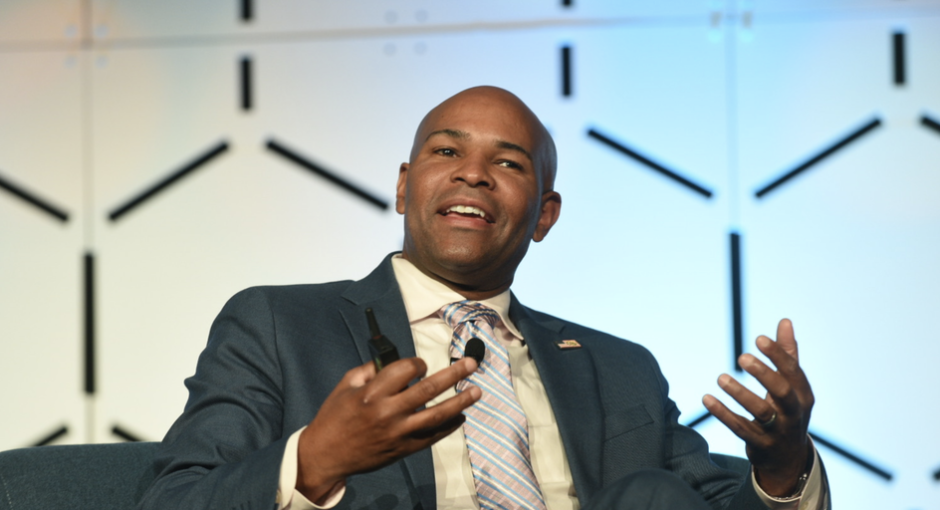 Former U.S. Surgeon General Jerome Adams speaking at a conference