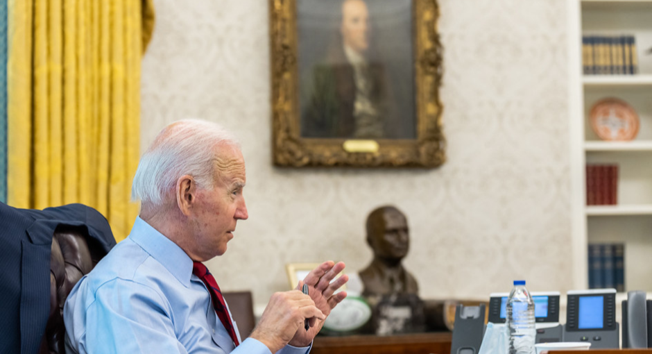 President Joe Biden seated in the Oval Office