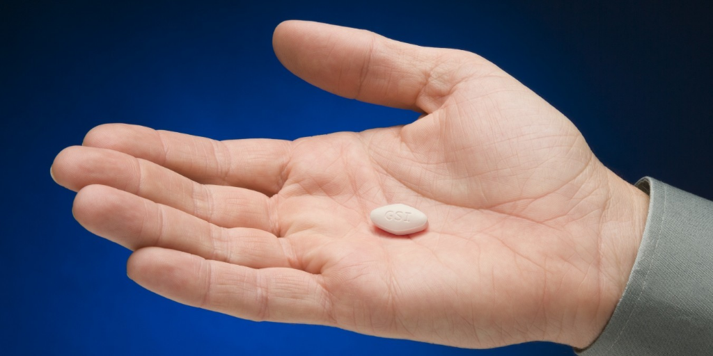 pill in palm of open hand