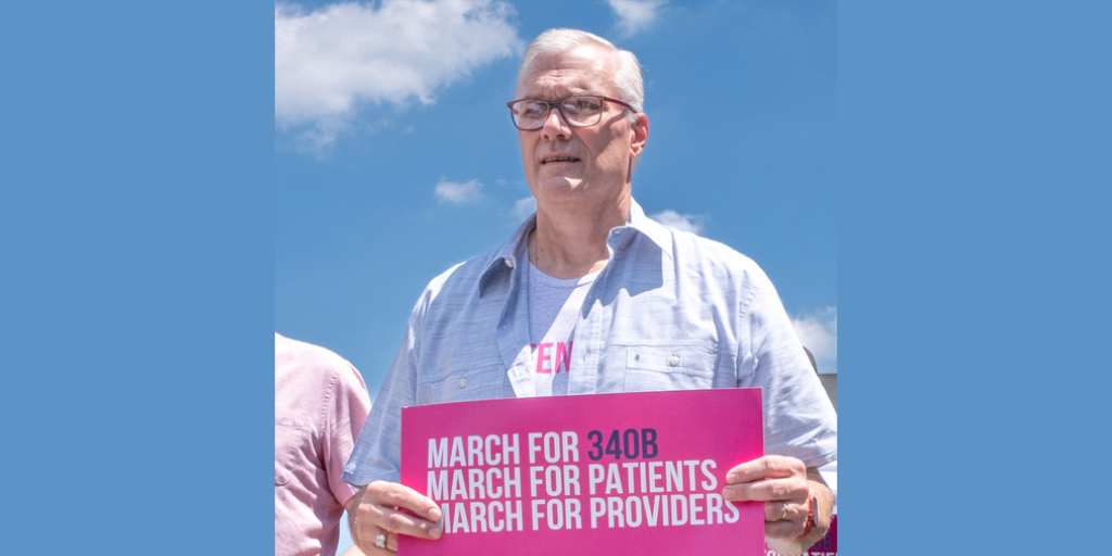 Mark Malahosky pictured with March for 340B placard