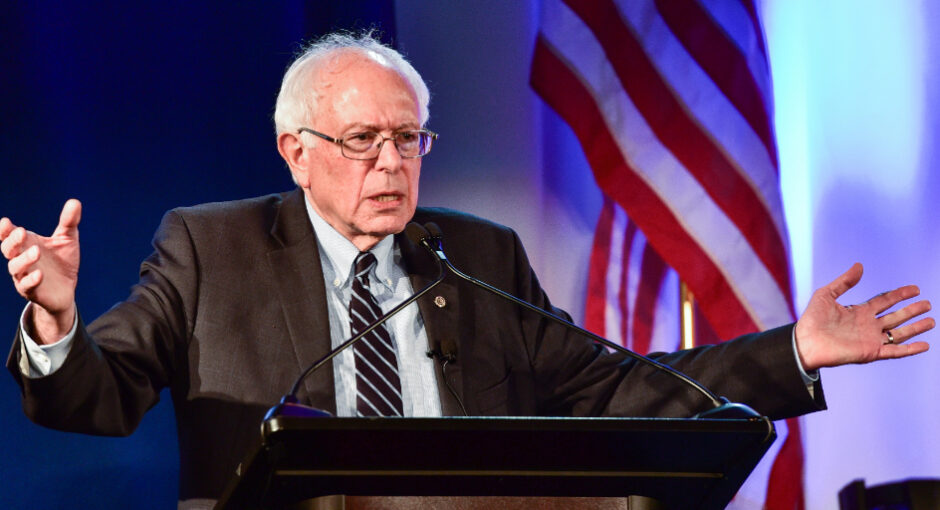 Sen. Bernie Sanders speaking at a podium