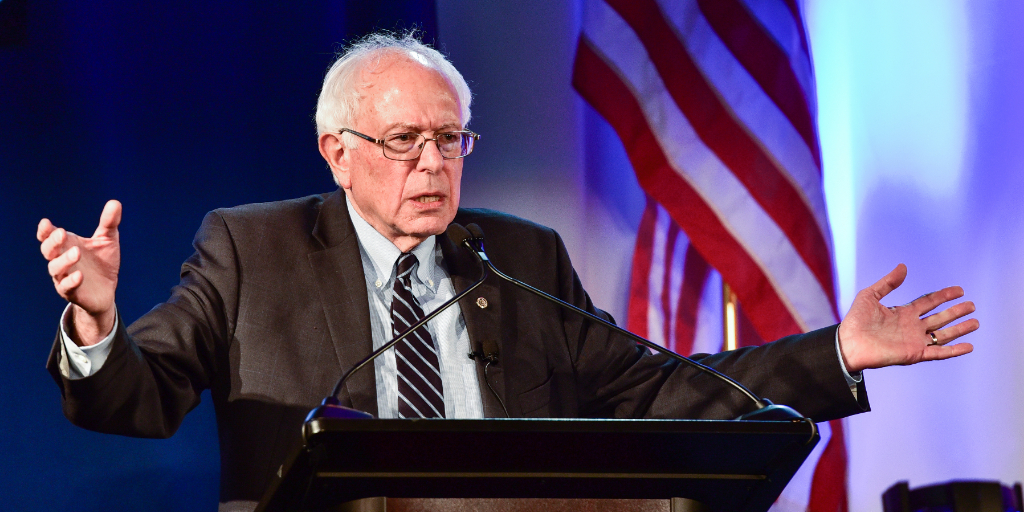 Sen. Bernie Sanders speaking at a podium